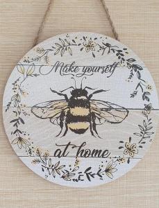 a plate with a bee on it with the words make yourself at home at A-Wave From It All in Montrose