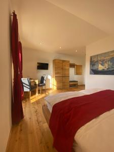 a bedroom with a bed and a desk in a room at Trautenburg Stub`n in Leutschach +51 photos