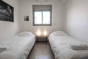 Una cama o camas en una habitación de Luxury Marina 4BR apartment by Airsuite