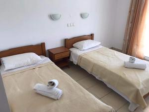 Postel nebo postele na pokoji v ubytování Αγνάντι ενοικιαζόμενα δωμάτια