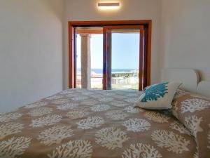 Säng eller sängar i ett rum på Porto Quadro Villa's