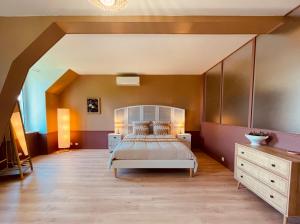 Giường trong phòng chung tại La Bastide Champenoise - Chambres d'hôtes