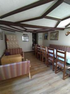 a room with a row of chairs and a table at Holiday Home Jakovci in Netretić
