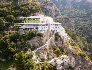 a building on the side of a mountain at Grand Hotel Tritone in Praiano