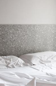 Postel nebo postele na pokoji v ubytování Elide Design Hotel
