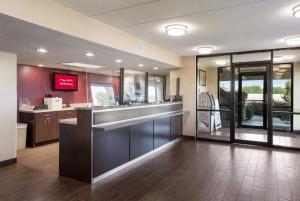 a restaurant lobby with a counter and a bar at Red Roof Inn Philadelphia - Trevose in Trevose