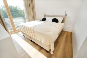 Posteľ alebo postele v izbe v ubytovaní Apartmán v stráni