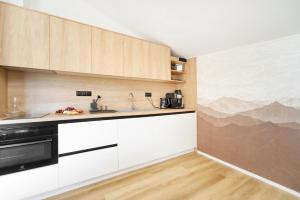 Kuchyňa alebo kuchynka v ubytovaní Apartmán v stráni