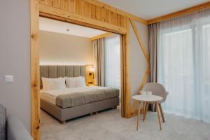 Posteľ alebo postele v izbe v ubytovaní Platinum Mountain Hotel&SPA