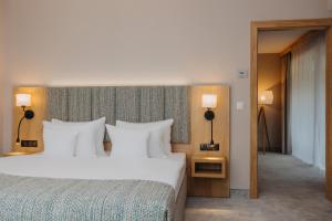 Posteľ alebo postele v izbe v ubytovaní Platinum Mountain Hotel&SPA