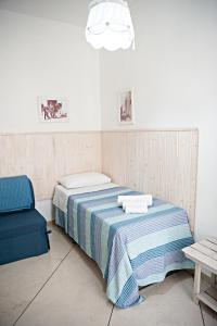 A bed or beds in a room at Vacanze al San Domenico