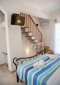 A bed or beds in a room at Vacanze al San Domenico