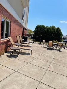 a group of chairs and tables on a patio at Holiday Inn Express & Suites Niagara Falls by IHG in Niagara Falls