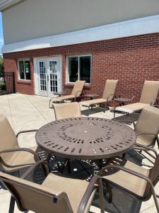 a black table and chairs on a patio at Holiday Inn Express & Suites Niagara Falls by IHG in Niagara Falls