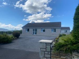 a house with a driveway in front of it at Sandfield View in Ardara