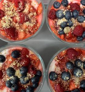four plastic containers filled with fruit and berries at The County Hotel in Helensburgh +22 photos