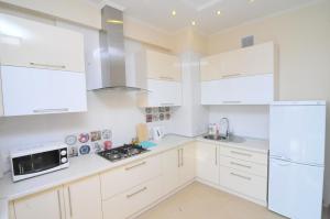 Kuchyň nebo kuchyňský kout v ubytování HomeService Apartments on Stefan cel Mare boulevard + 4 fotografie