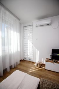Postel nebo postele na pokoji v ubytování Apartman Minja