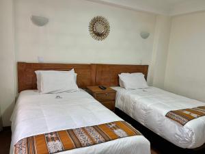 Postel nebo postele na pokoji v ubytování Hostal Casona Arrambide