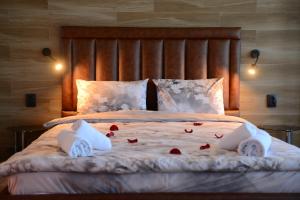 Säng eller sängar i ett rum på Family Hotel Gotse Delchev