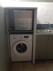 A kitchen or kitchenette at Comfy Apartment near the Sea