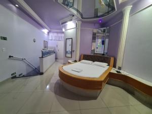 a hospital room with a bed in the middle at Euro Motel (Only Adults) in Viracopos