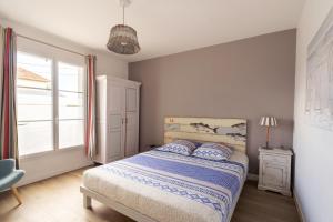 Voodi või voodid majutusasutuse Villa du Littoral toas