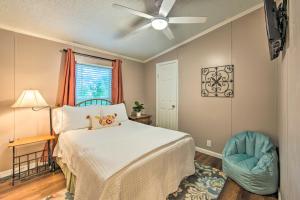 a bedroom with a bed and a ceiling fan at Lakefront Mabank Gem with Sunset Views Pets Welcome in Mabank