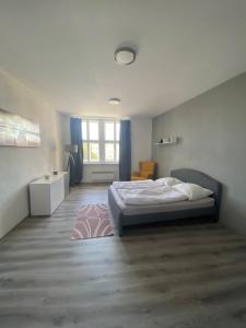 Postel nebo postele na pokoji v ubytování Apartmán na náměstí