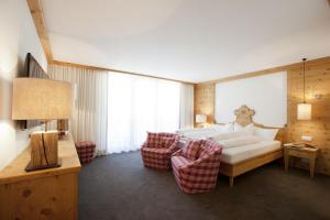Postel nebo postele na pokoji v ubytování Hotel Walliserstube