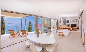 a living room with a table and chairs at Villa Bobara in Mlini