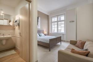 a bedroom with a bed and a sink in a room at Basilika Monnalisa luxury 3 bedrooms apartment with amazing view NEED RESERVATION X FREE PARKING in Budapest
