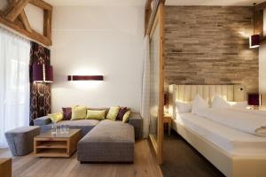 Postel nebo postele na pokoji v ubytování Hotel Walliserstube