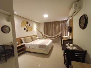 Ένα ή περισσότερα κρεβάτια σε δωμάτιο στο Hotel Palace Santarém Brasil