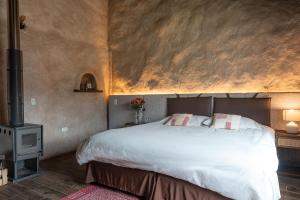 Voodi või voodid majutusasutuse Chilcabamba Lodge toas