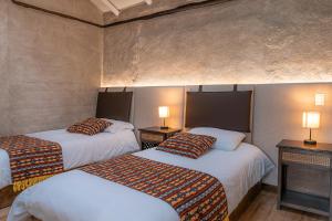 Voodi või voodid majutusasutuse Chilcabamba Lodge toas