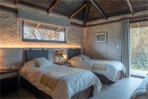 Voodi või voodid majutusasutuse Chilcabamba Lodge toas