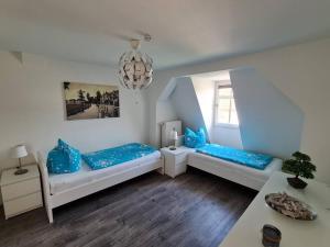 Postel nebo postele na pokoji v ubytování Gästewohnung Eulennest