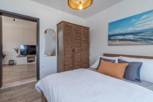 Katil atau katil-katil dalam bilik di Beach Apartman Marela