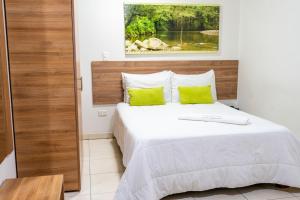 Hotel Condina Pereira客房内的一张或多张床位