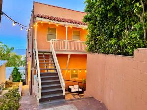 a house with a staircase leading up to it at The Riviera in San Pedro