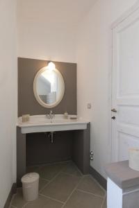 a bathroom with a sink and a mirror at Crealto in Alfiano Natta