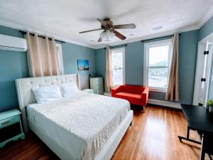 a bedroom with a bed and a ceiling fan at Luxury Executive Suite Harvard Allston 3 Bedrooms 2 Baths in Boston