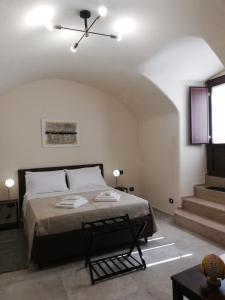 Postel nebo postele na pokoji v ubytování Arco Bianco b&b