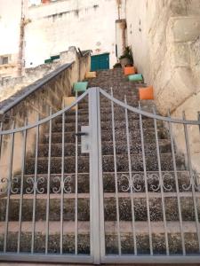a set of stairs with a metal railing at B&B Il Caminetto in Matera