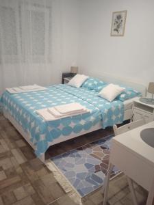 Postel nebo postele na pokoji v ubytování Apartments Jela