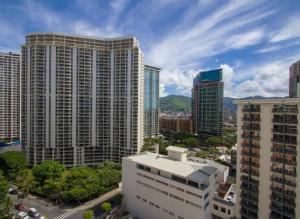 a view of a city skyline with tall buildings at Vacation Apartment for Couples in Honolulu Hawaii in Honolulu