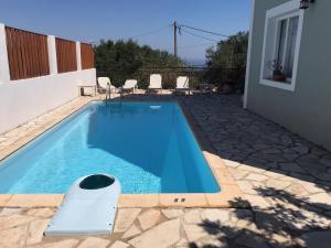 The swimming pool at or close to Regina Villa