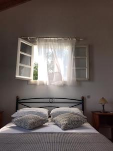 A bed or beds in a room at Regina Villa
