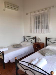 A bed or beds in a room at Regina Villa